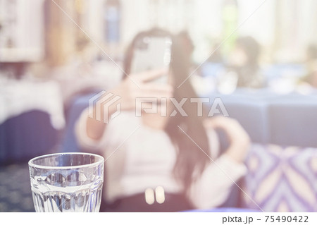 Blurred shot of a girl doing selfie 75490422