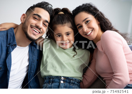 Closeup Portraif Of Happy Arabic Family Of Three With Little Daughter Closeup Portraif Of Happy Arabic Family Of Three With Little Daughter 75492541