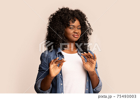 Black woman feeling unpleasant scent or showing disregard Black woman feeling unpleasant scent or showing disregard 75493003