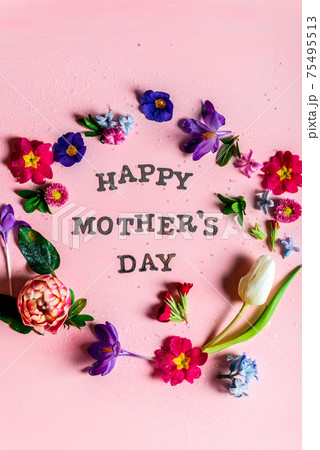 Happy Mothers Day letters with different spring flowers around them Happy Mothers Day letters with different spring flowers around them 75495513