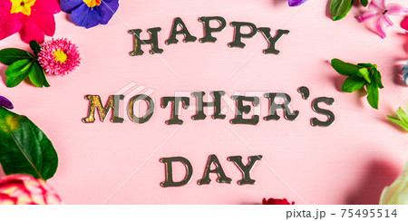 Happy Mothers Day letters with different spring flowers around them Happy Mothers Day letters with different spring flowers around them 75495514