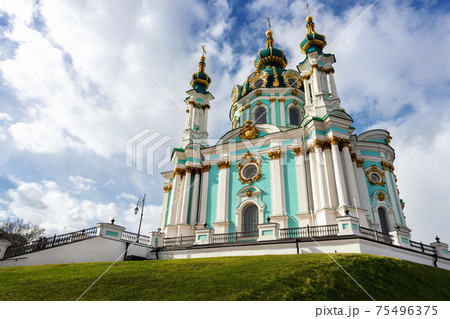 Beautiful scenic view of Saint Andrew s Church against blue sky on bright spring day in Kiev old city center. Ukrainian capital Kiyv famous podol sightseeing landmark poi Beautiful scenic view of Saint Andrew s Church against blue sky on bright spring day in Kiev old city center. Ukrainian capital Kiyv famous podol sightseeing landmark poi 75496375