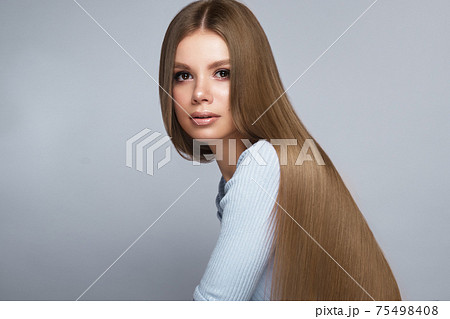 Beautiful blond girl with a perfectly smooth hair, and classic make-up. Beauty face and hair. Beautiful blond girl with a perfectly smooth hair, and classic make-up. Beauty face and hair. 75498408