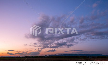 Colorful sunset and sunrise with clouds. Blue and orange color of nature. Many white clouds in the blue sky. The weather is clear today. sunset in the clouds. The sky is twilight. Colorful sunset and sunrise with clouds. Blue and orange color of nature. Many white clouds in the blue sky. The weather is clear today. sunset in the clouds. The sky is twilight. 75507622