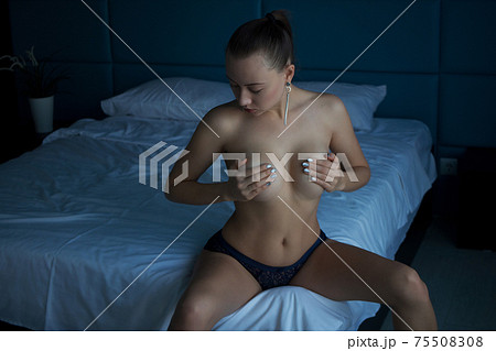 Topless voluptuous woman in bedroom 75508308