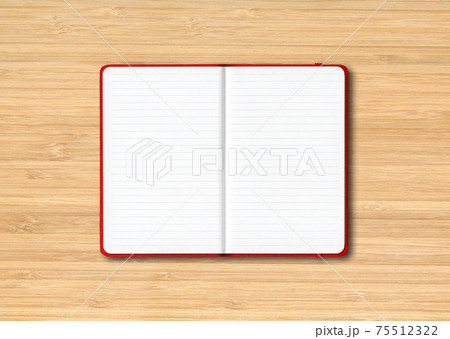 Red open lined notebook isolated on wooden background Red open lined notebook isolated on wooden background 75512322