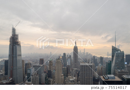 New York skyline from the top of The rock observation deck in Rockefeller center sunset view with clouds in the sky New York skyline from the top of The rock observation deck in Rockefeller center sunset view with clouds in the sky 75514017