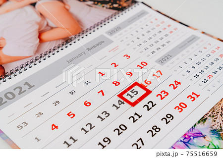 a calendar fragment with a family photo.  75516659