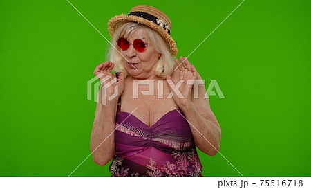 Scared elderly woman tourist stretching out hands, stop gesture to hide from fear, panic attack 75516718
