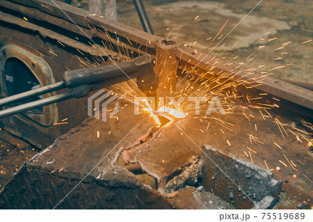 Sparkle from Oxygen Acetylene Cutting Torch for Car Body Part Removal in Vintage Tone 75519689