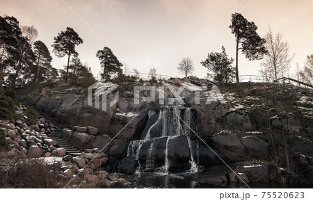 Landscape photo with waterfall in public city park of Kotka, Finland 75520623