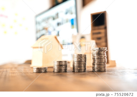 Money coin Grow up business and computer Concept,Silver coins stacked on wooden desks. Money coin Grow up business and computer Concept,Silver coins stacked on wooden desks. 75520672