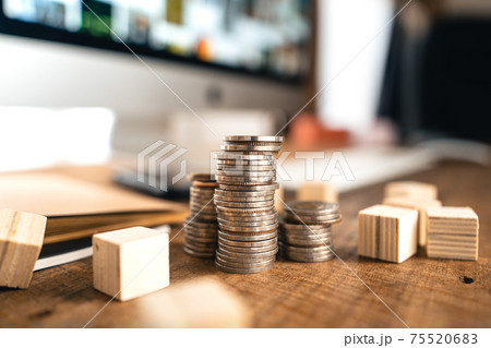 Money coin Grow up business and computer Concept,Silver coins stacked on wooden desks. Money coin Grow up business and computer Concept,Silver coins stacked on wooden desks. 75520683