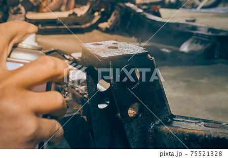 Car Mechanic Spray Paint Car Chassis for Rust Protection in Vintage Tone Car Mechanic Spray Paint Car Chassis for Rust Protection in Vintage Tone 75521328