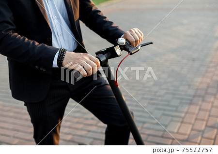 Close up image of man on an electric scooter...の写真素材 PIXTA