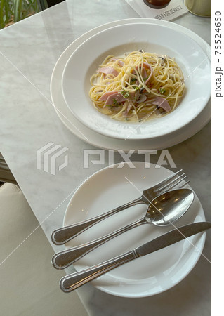 Italian Spahgetti cream source with mushroom and ham serve on white dish in restaurant. 75524650