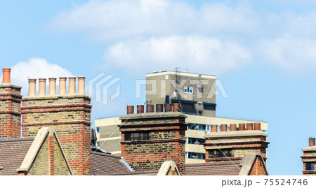 Typical English chimneys on the roofs of London buildings Typical English chimneys on the roofs of London buildings 75524746
