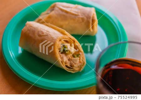 Chicken breast with caesar dressing and lettuce in a gluten-free tortilla wrap 75524995