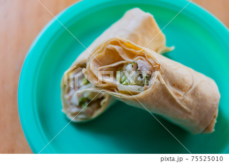 Chicken breast with caesar dressing and lettuce in a gluten-free tortilla wrap Chicken breast with caesar dressing and lettuce in a gluten-free tortilla wrap 75525010
