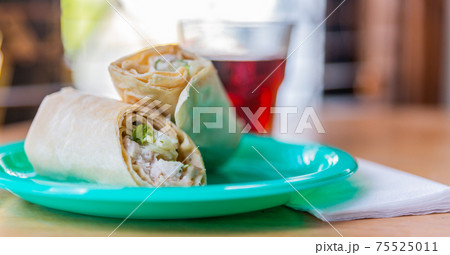 Chicken breast with caesar dressing and lettuce in a gluten-free tortilla wrap 75525011