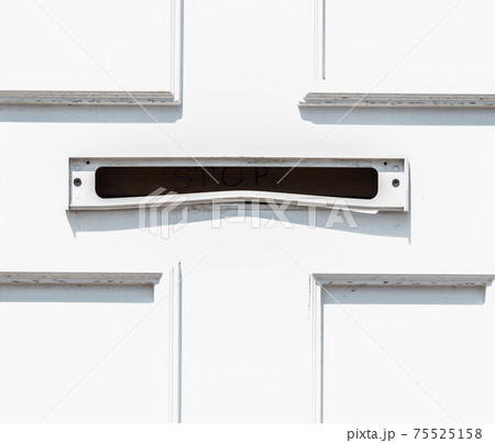 Old letterbox in the door, traditional way of delivering letters to the house, old mailbox 75525158