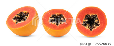 half  ripe papaya fruit with seeds  on white background 75526035