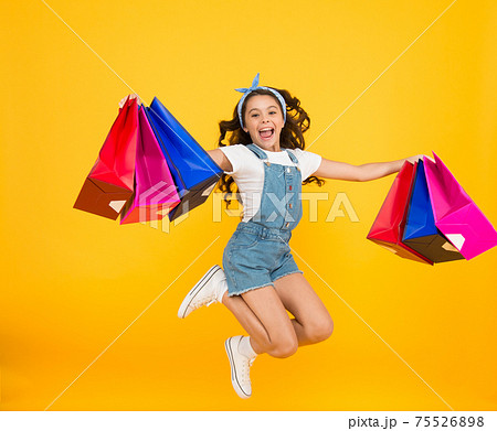 Real happiness. happy small girl after successful shopping Real happiness. happy small girl after successful shopping 75526898