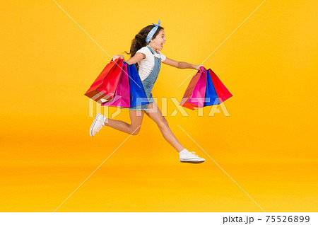 Trends and brands. Towards discounts. Happy girl jump Trends and brands. Towards discounts. Happy girl jump 75526899