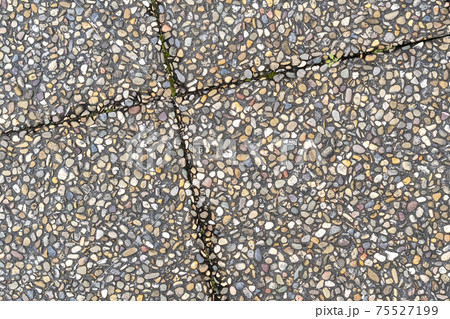 Pebble stone in outdoor tiles with geometric diagonal shapes. Close up. Copy space 75527199