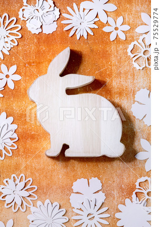 Easter bunny rabbit with paper flowers around 75529774