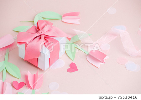 Holiday greeting card pink background with gift, Naive paper cut flowers tulips. Valentine's Day, Happy Women's Day, Mother's Day, Birthday, Wedding, space for text, foil baloon, stylish flyer, banner 75530416