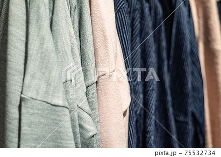 various clothes on hangers in the store various clothes on hangers in the store 75532734
