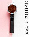Espresso machine filter with ground coffee. 75533680