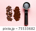 Espresso machine filter, ground coffee and coffee beans. 75533682