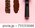 Detail of espresso machine filter, ground coffee and coffee beans. 75533686
