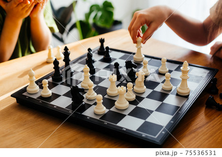 Moments of intensive thinking and anticipation while chess game 75536531