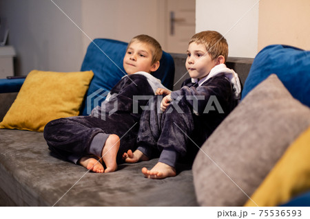 the little brothers in kigurumi watching tv at home the little brothers in kigurumi watching tv at home 75536593