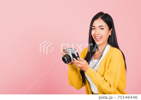 woman teen excited smiling holding vintage photo camera woman teen excited smiling holding vintage photo camera 75540446