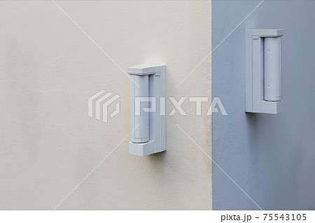 Burglar alarm sensors are mounted on the outer wall of the house. Burglar alarm sensors are mounted on the outer wall of the house. 75543105