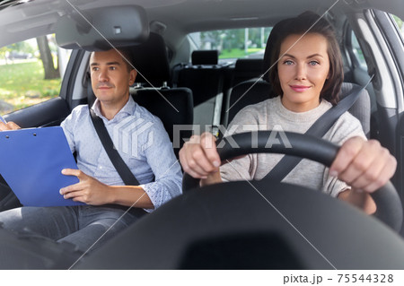 car driving school instructor and young driver 75544328