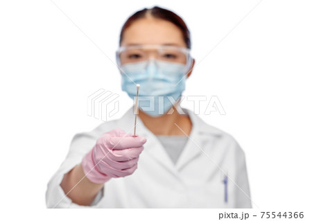 asian female doctor in mask with test cotton swab 75544366