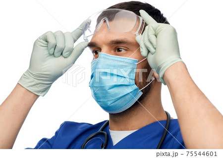 male doctor in goggles, mask and gloves 75544601