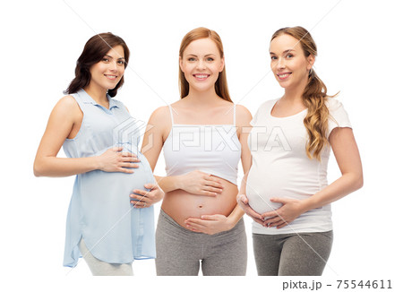 happy pregnant women touching their big bellies 75544611