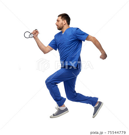 doctor or male nurse with stethoscope jumping doctor or male nurse with stethoscope jumping 75544779