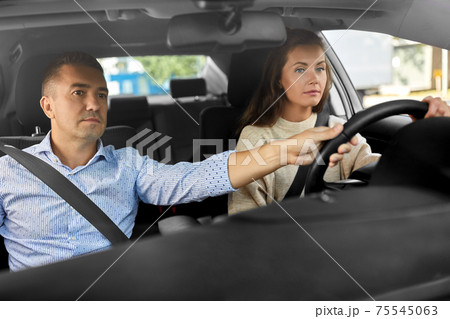 car driving school instructor teaching woman car driving school instructor teaching woman 75545063