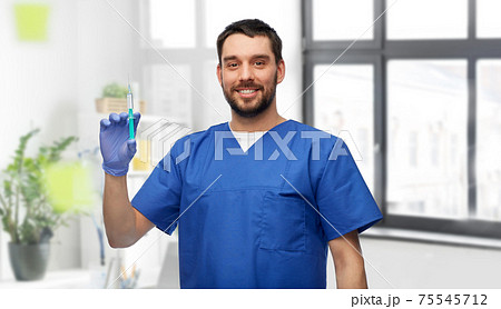 doctor or male nurse with medicine in syringe 75545712