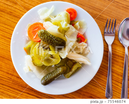 Turkish pickles made with cucumber, cabbage and carrots closeup Turkish pickles made with cucumber, cabbage and carrots closeup 75546074