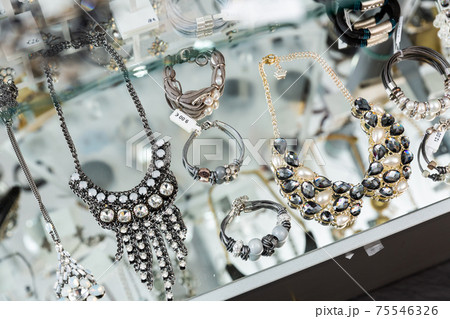 Various adornments on showcase in bijouterie shop 75546326