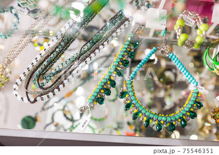 Various designs of imitation jewellery on showcase in shop Various designs of imitation jewellery on showcase in shop 75546351