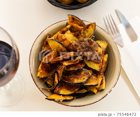 Fried eggplant with honey, classic Andalusian dish Fried eggplant with honey, classic Andalusian dish 75546472